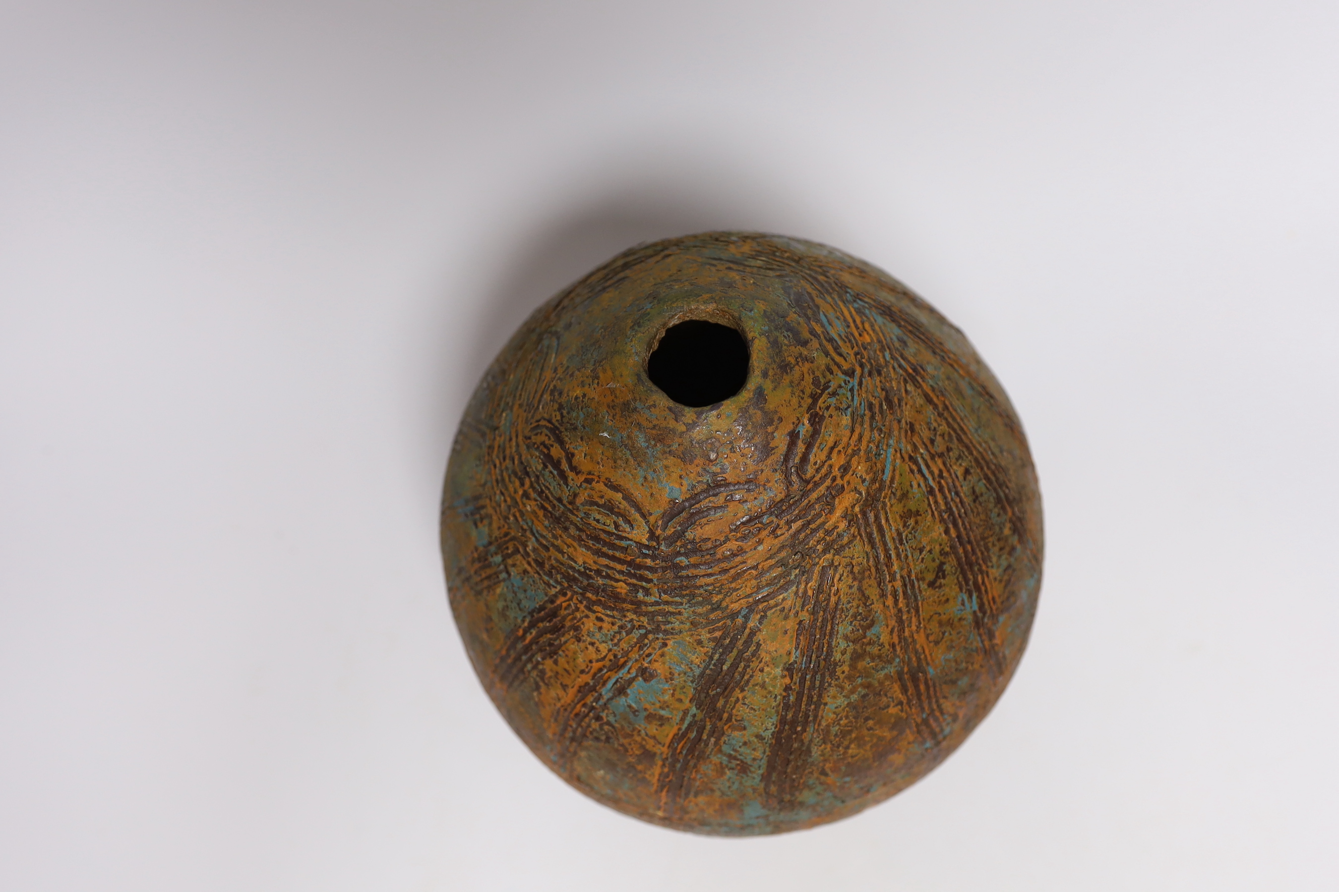 A Pre-Columbian style ovoid earthenware vase, 26cm high